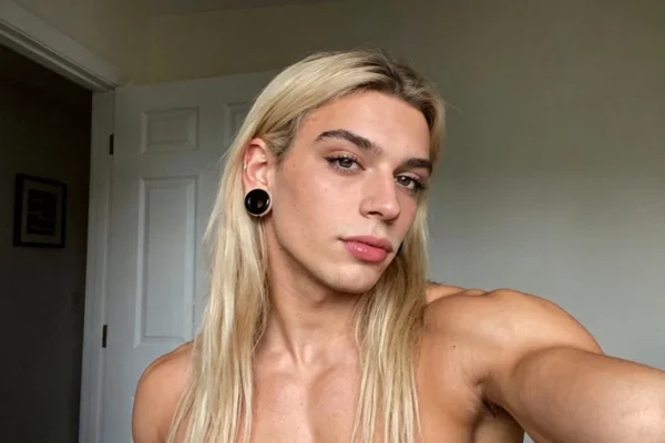 beautiful blond femboy taking a selfie